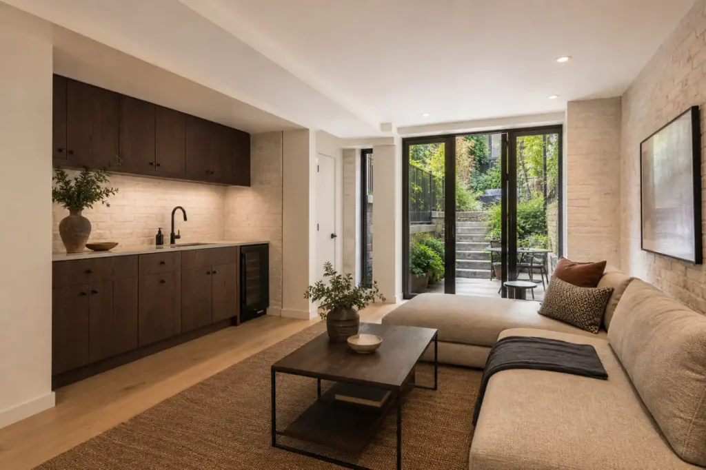 Finished Carroll Gardens brownstone garden-level family suite with built-in kitchenette and rear garden access