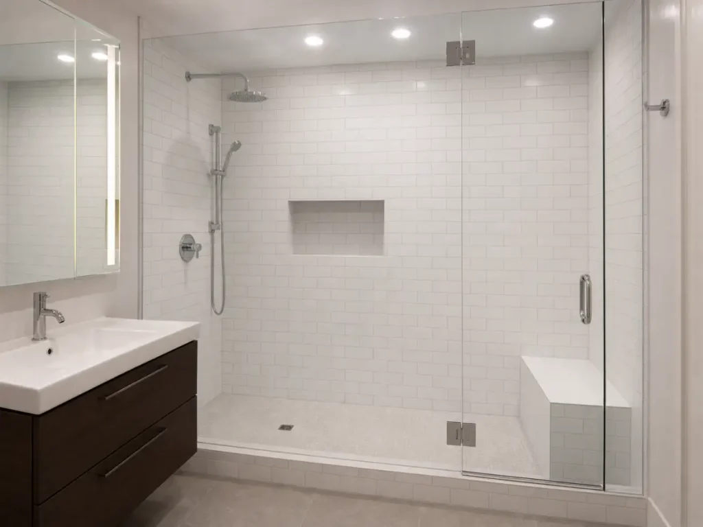 Large white subway-tile walk-in shower completed in an East 17th Street Manhattan loft