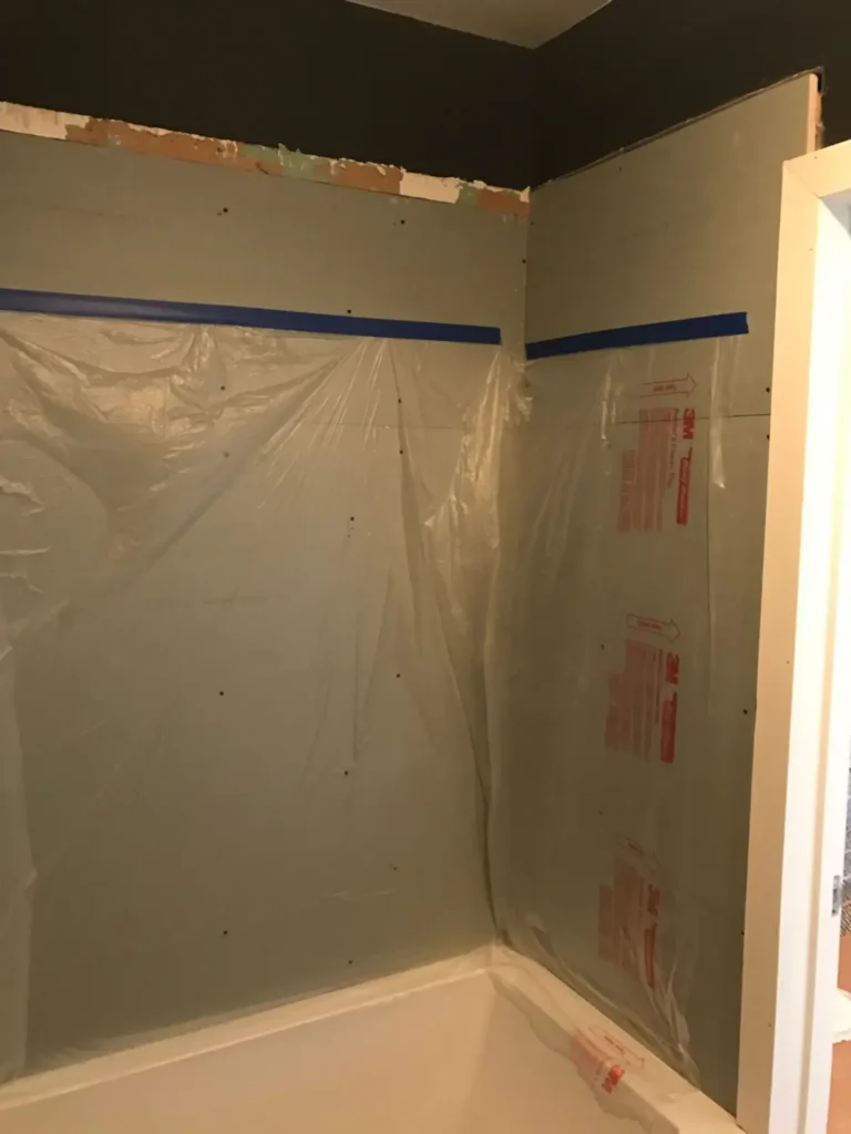 Bathroom tub surround prepared with backer board before waterproofing and subway tile