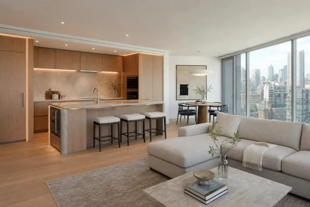 Renovated Williamsburg condo interior with custom oak kitchen, integrated lighting, and floor-to-ceiling windows